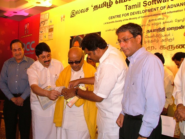 Mr.G.K.Vasan and Mr.Dayananidhi Maran helping Dr Kalaignar to open the release pack
