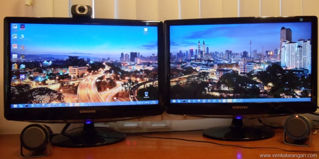 (My setup of Dual Monitors showing the awesome Cityscape Panoramic WallPaper in Windows8)