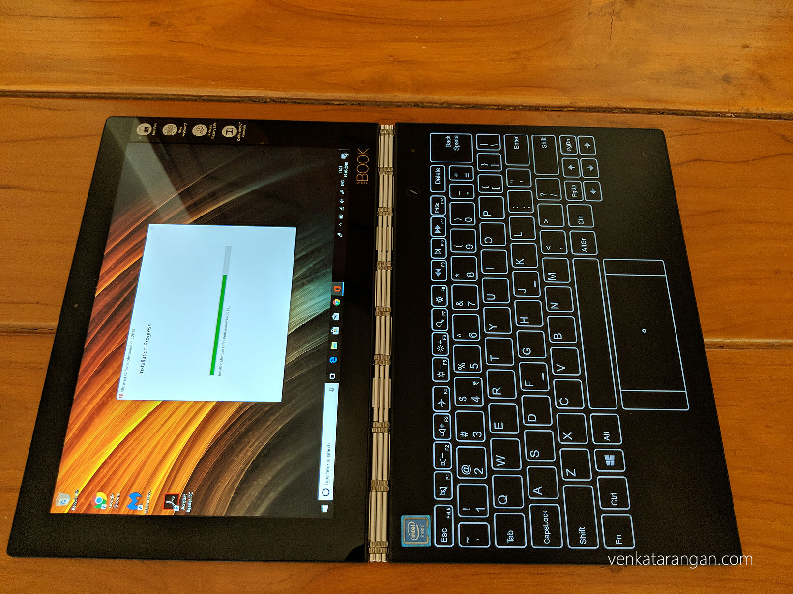 Notice the wristwatch strap hinges and the glass keyboard - Lenovo Yoga Book with Windows 