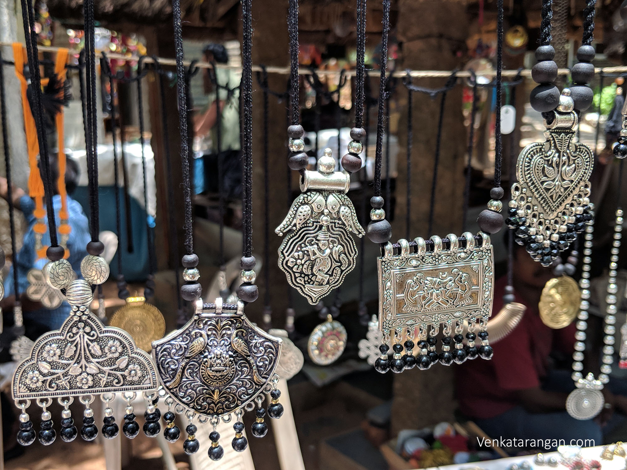 Shops manned by craftsmen sell beautiful jewellery, pottery and textile