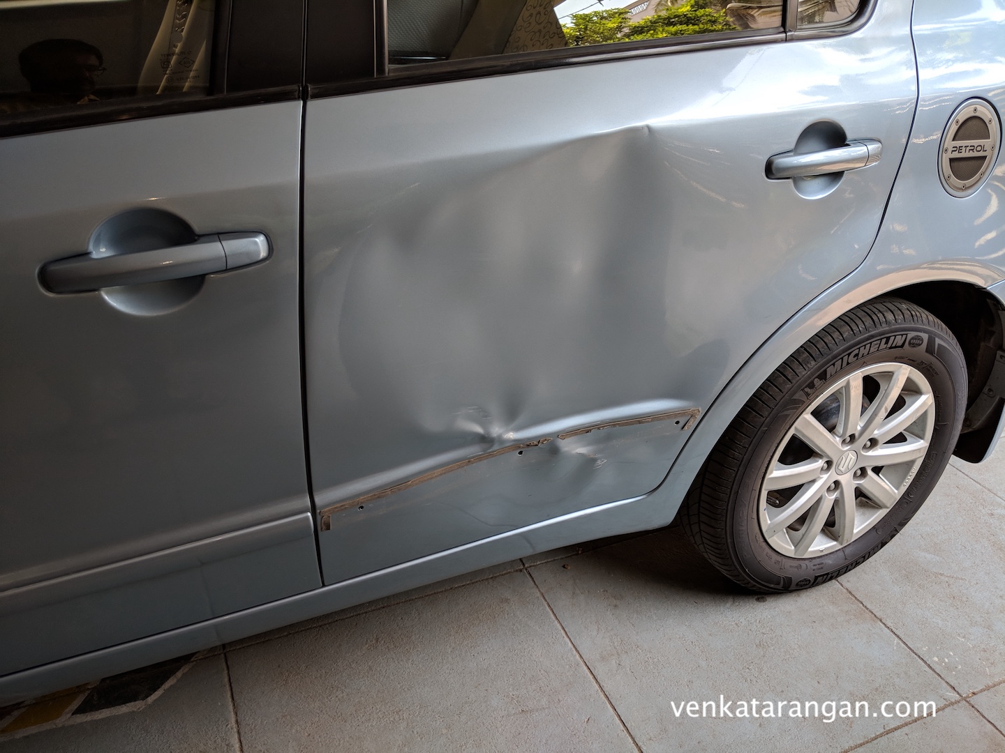 Car door that was damaged while left with valet parking