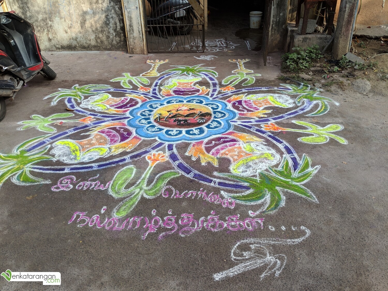A sunrise scene from a village drawn as a Kolam, also seen are sugarcanes and rice pots