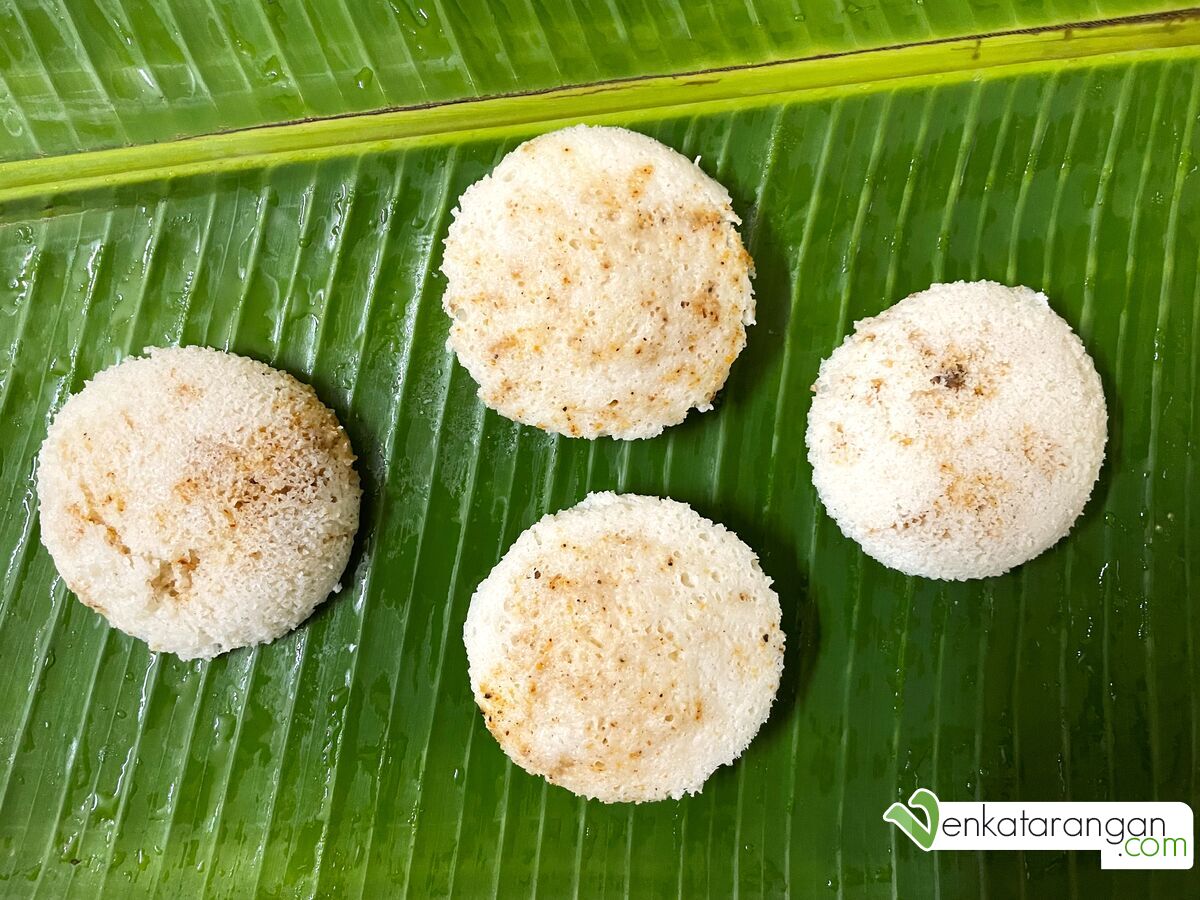The humble and healthy homemade Idli served on a Banana leaf, in the above picture it has been steamed with Idli Podi (Chutney Powder or Chilli Spice Powder) for taste.