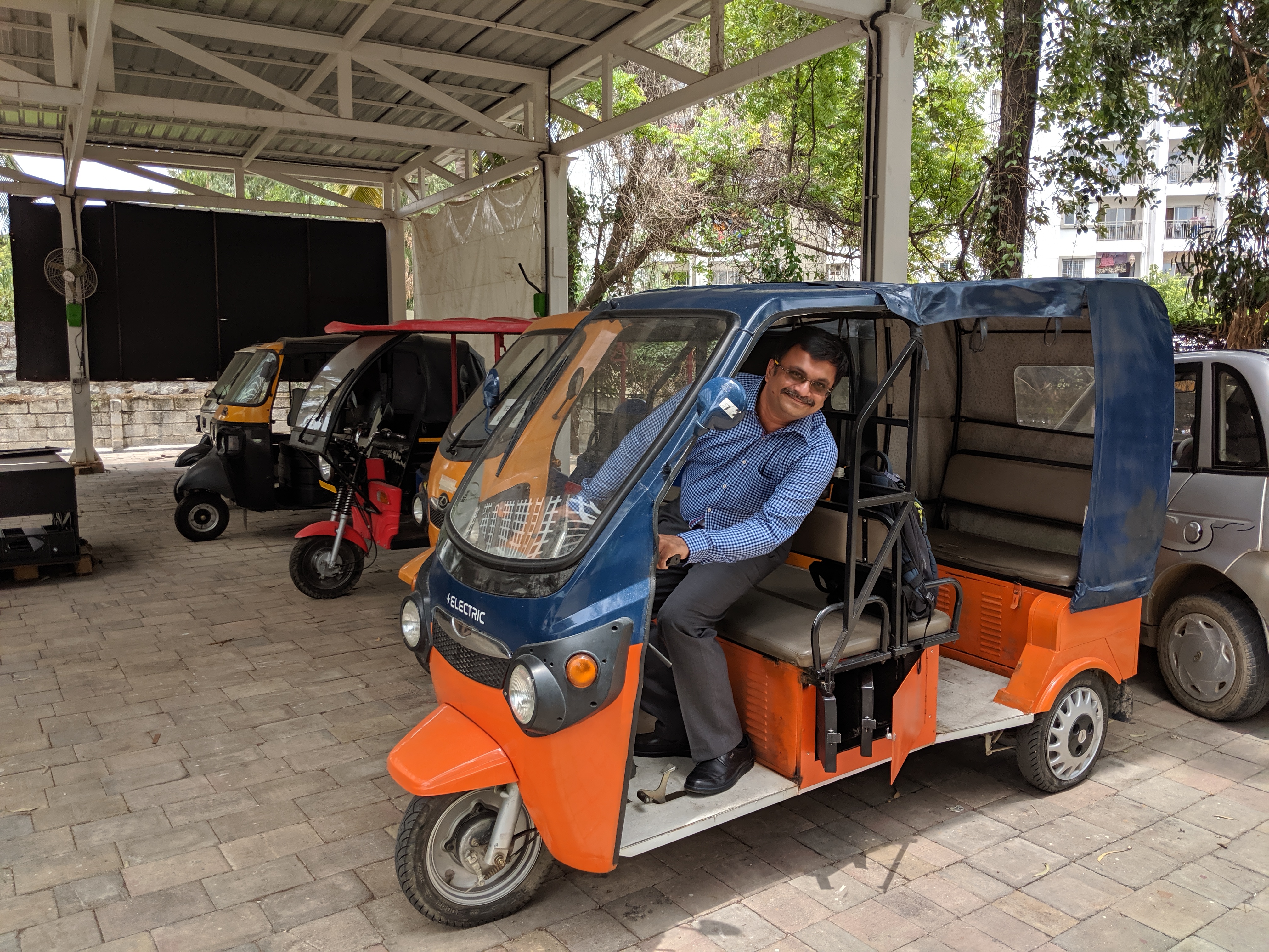 Venkatarangan driving an electric three wheeler