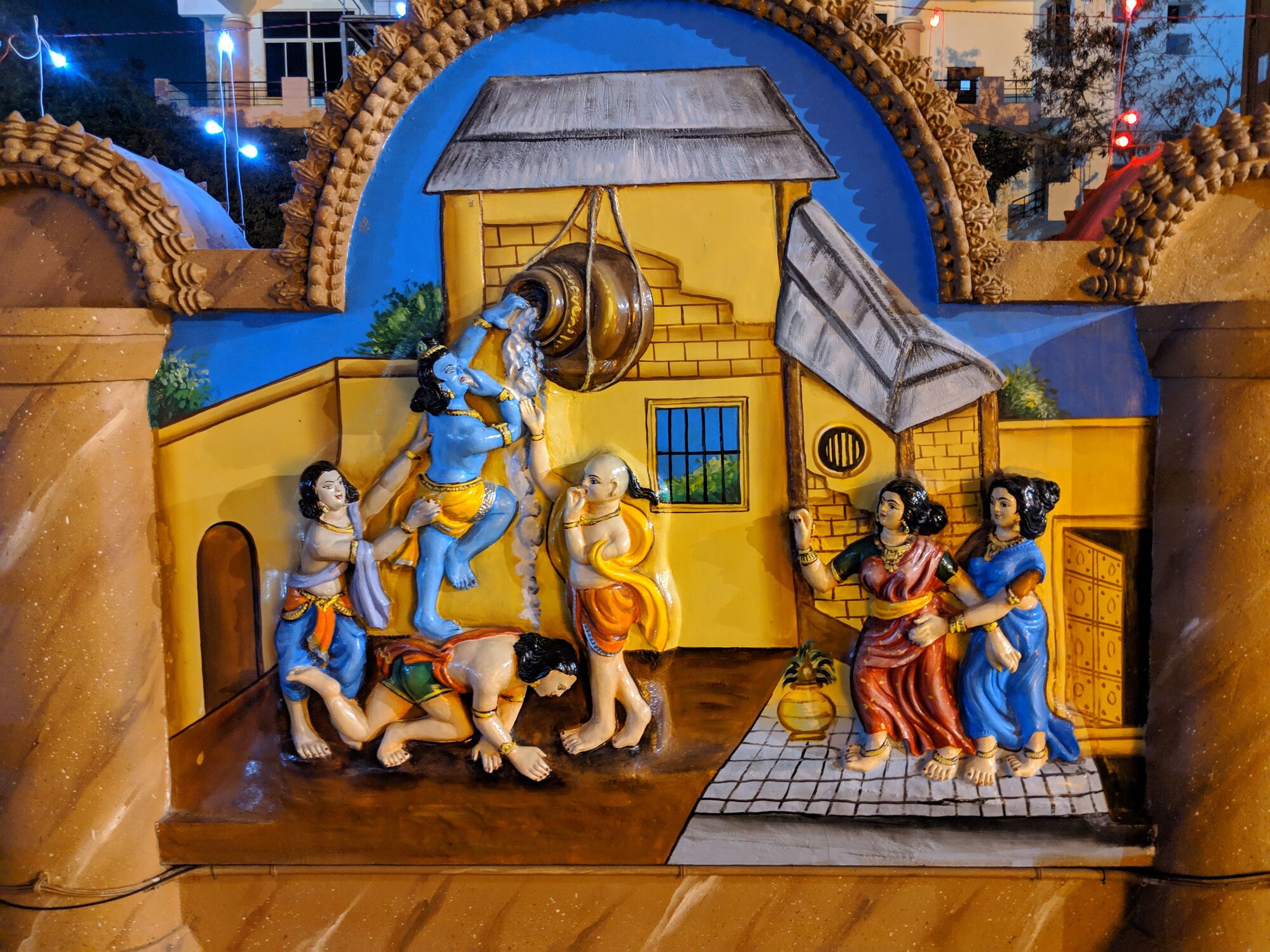 On the walls in the corridors outside, there are beautiful depictions of Sri Krishna Leela - this one is Baby Krishna stealing butter with his friends