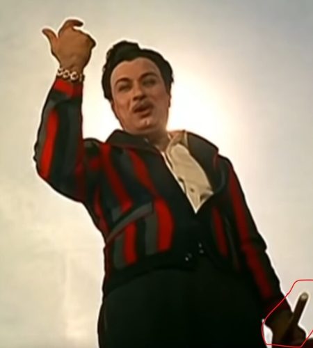 Why does MGR carry a baton in Anbe Vaa 1966 song?