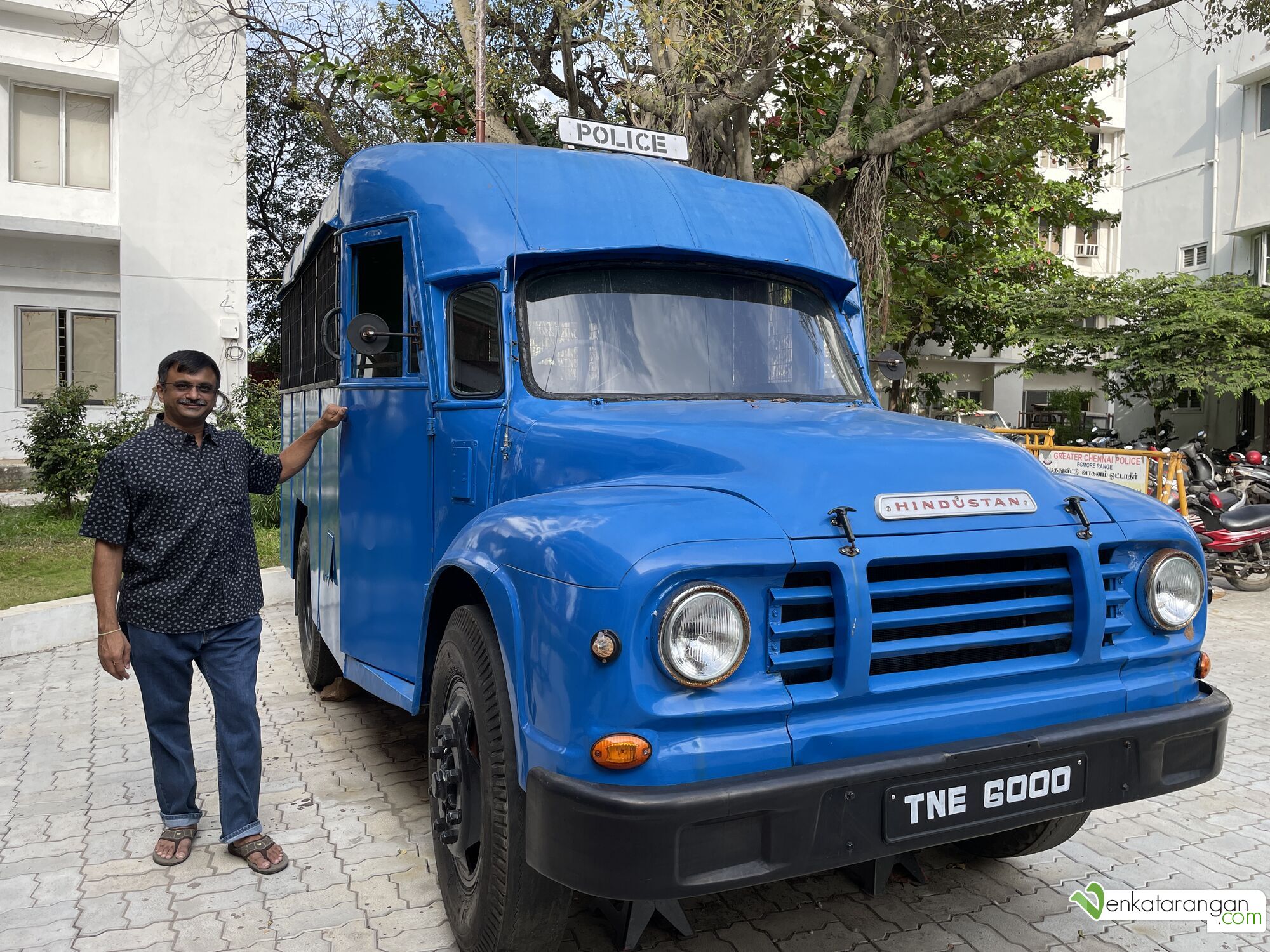 Venkatarangan standing next to a Hindustan Van - similar one appears in most Tamil movies