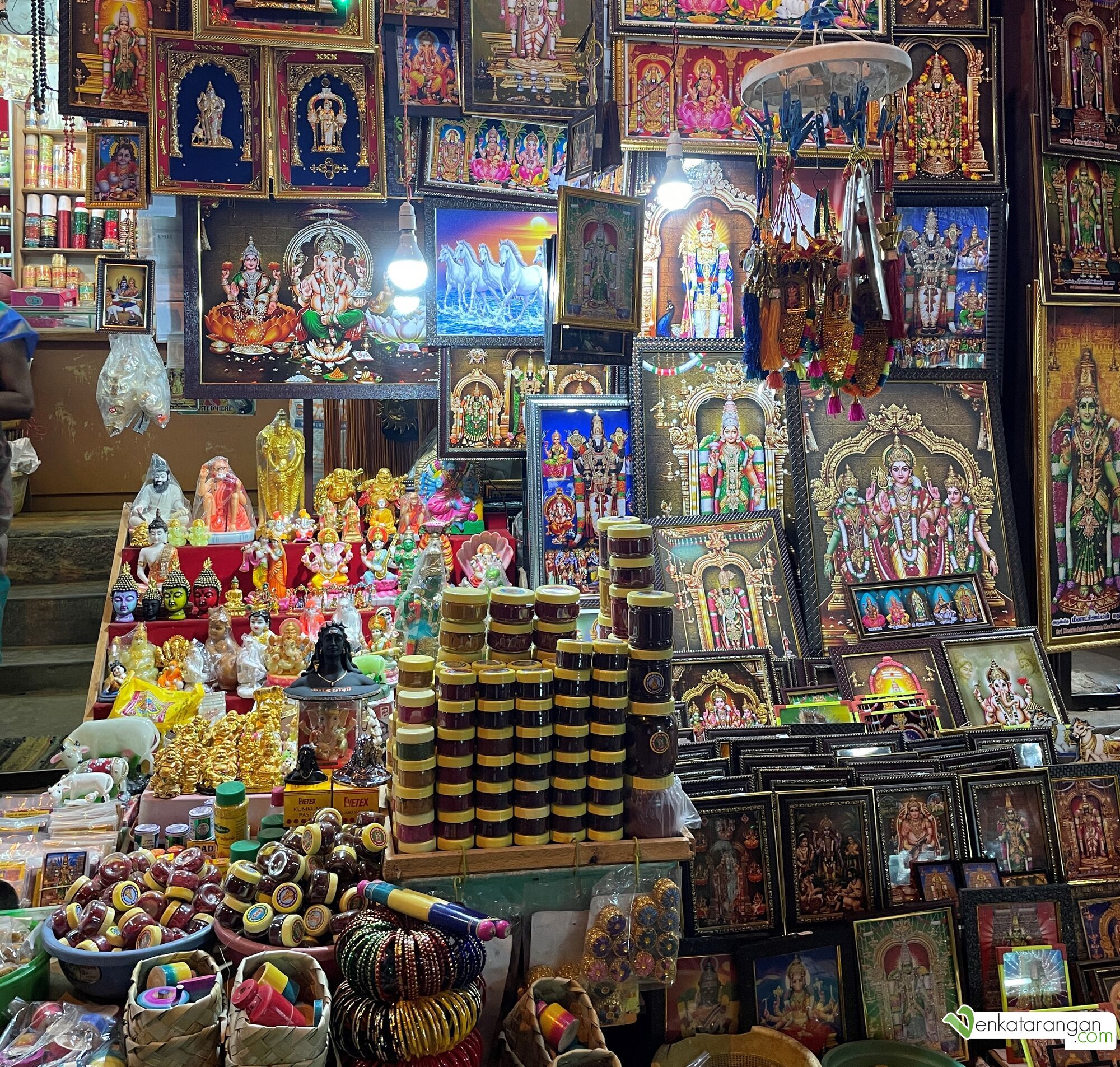 Shops near the temple sell picture frames of Goddess Meenakshi and other Gods