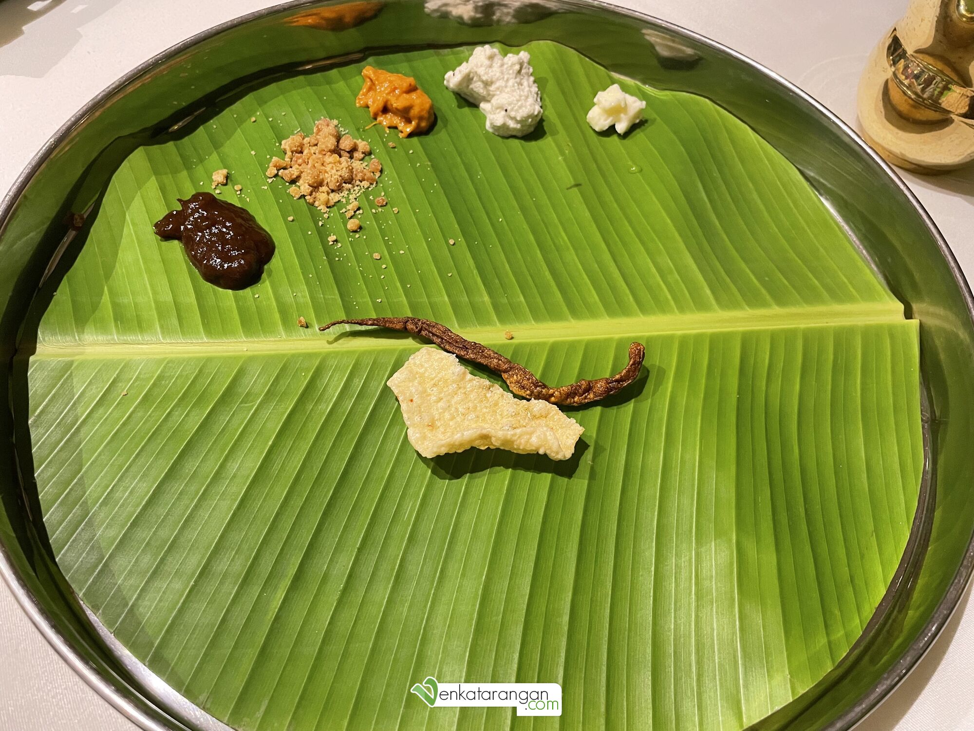 The starters in the vegetarian meal (thali) – Papad, Chutneys, Jaggery & Butter. This was followed by tiny Adai and Banana Dosai.