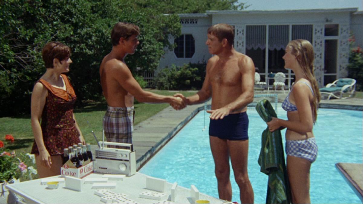 On the right are Burt Lancaster as Ned Merrill and Janet Landgard as Julie Ann Hooper in The Swimmer (1968)