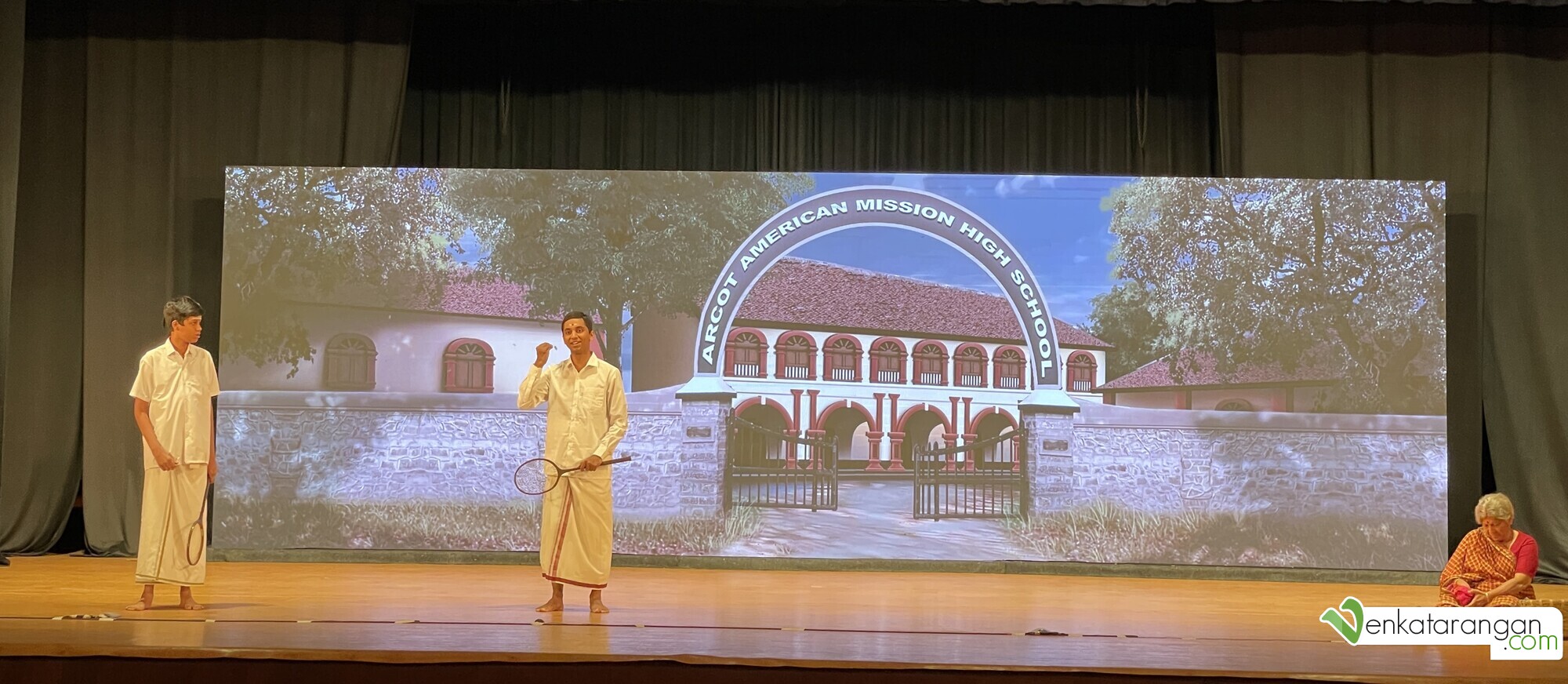 Actor Deeraj Mohan in front of a scene of the Arcot American Mission High School
