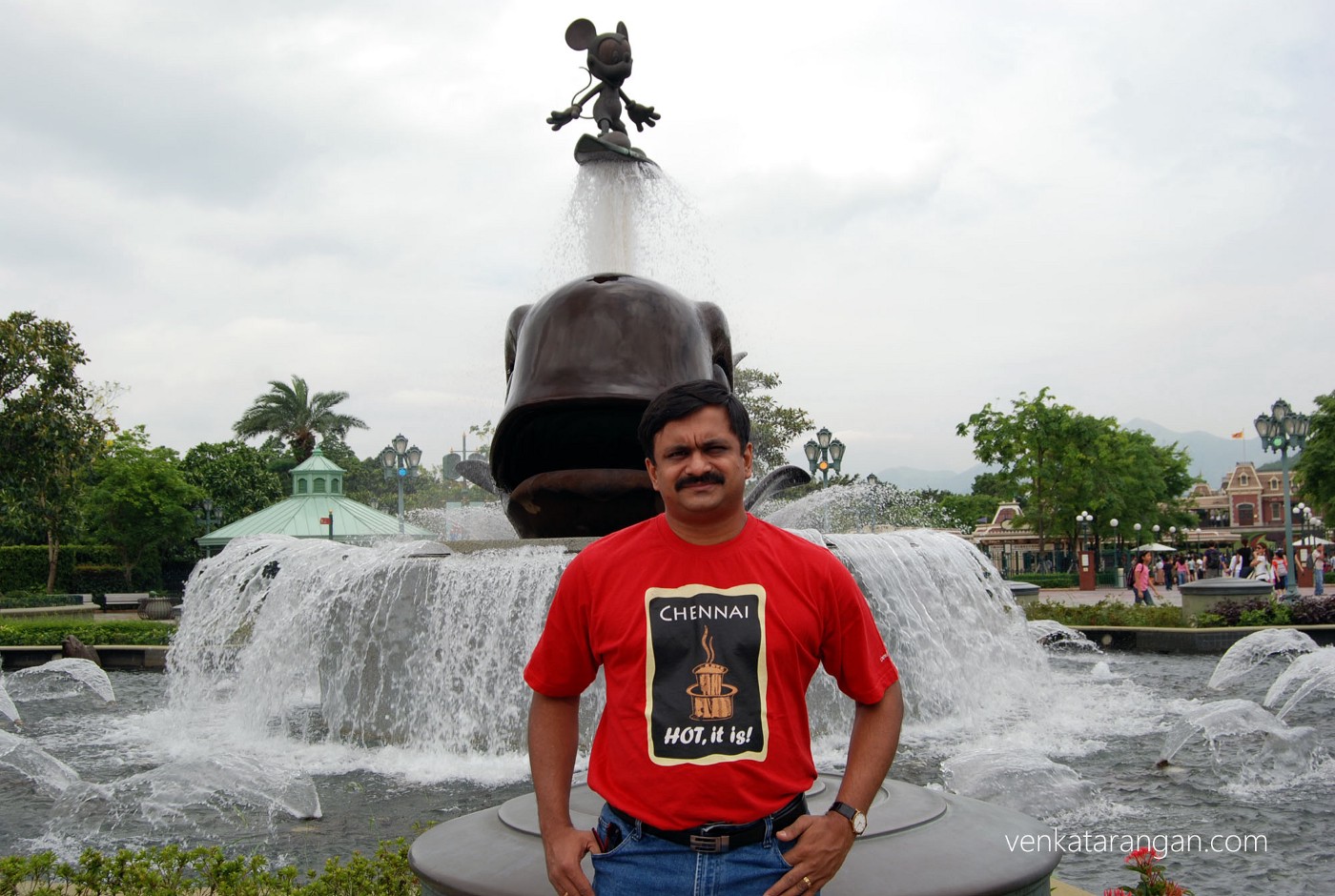 Venkatarangan in front of the Mickey Mouse surfing water fountain