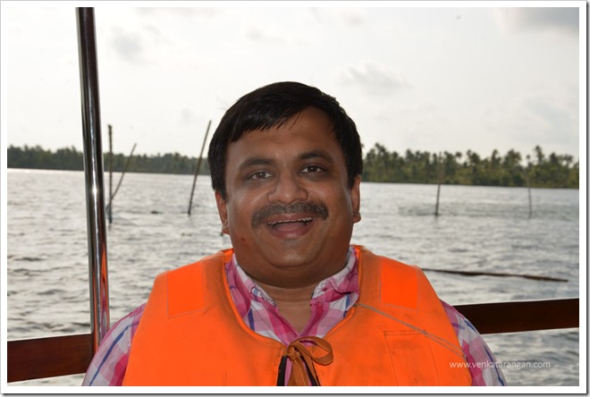 Venkatarangan on a boat ride in the Vembanad lake at the Vasudhara Sarovar - Vayalar Vacation