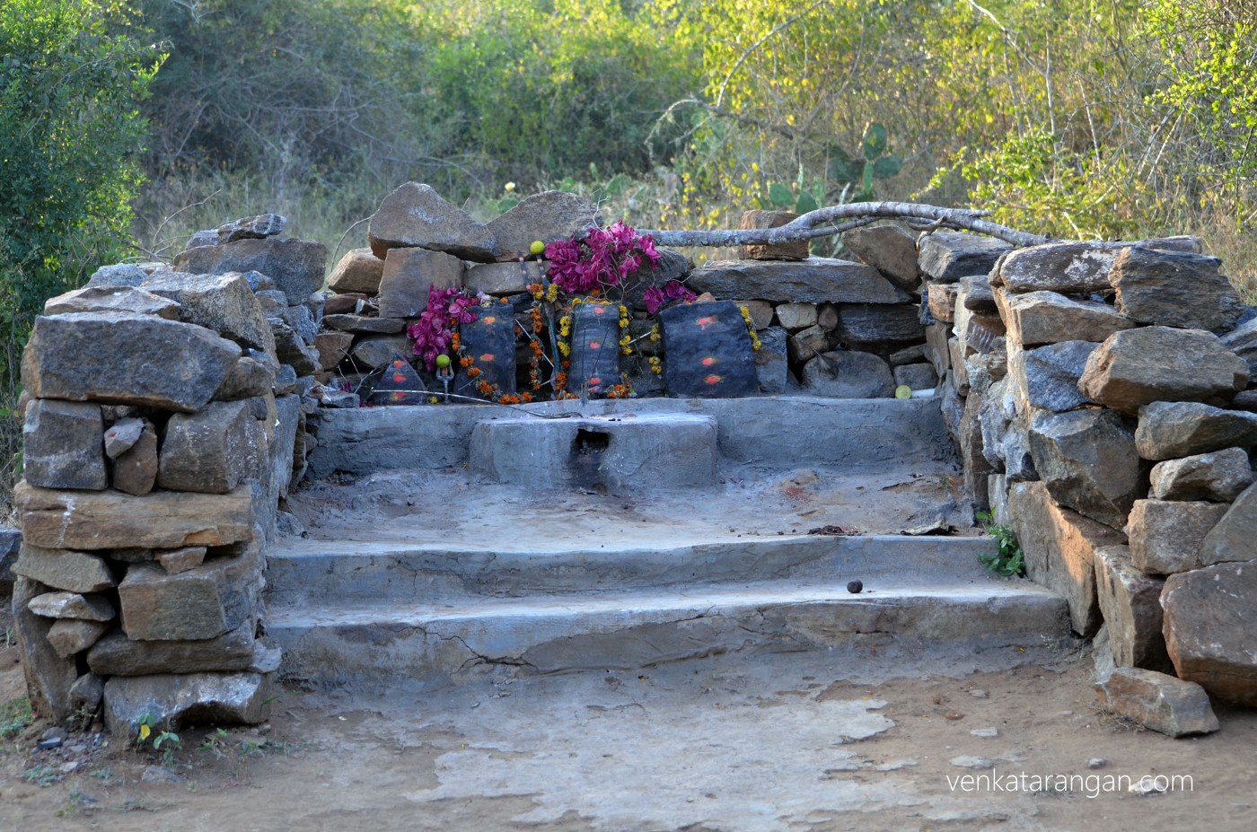 The black stones represent the Gods & Goddess, worshipped by local tribes in the area