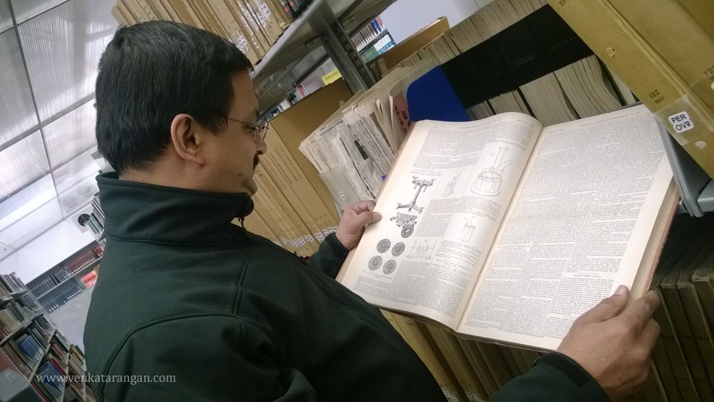 Venkatarangan holding a copy of the Scientific American Supplement from 1914