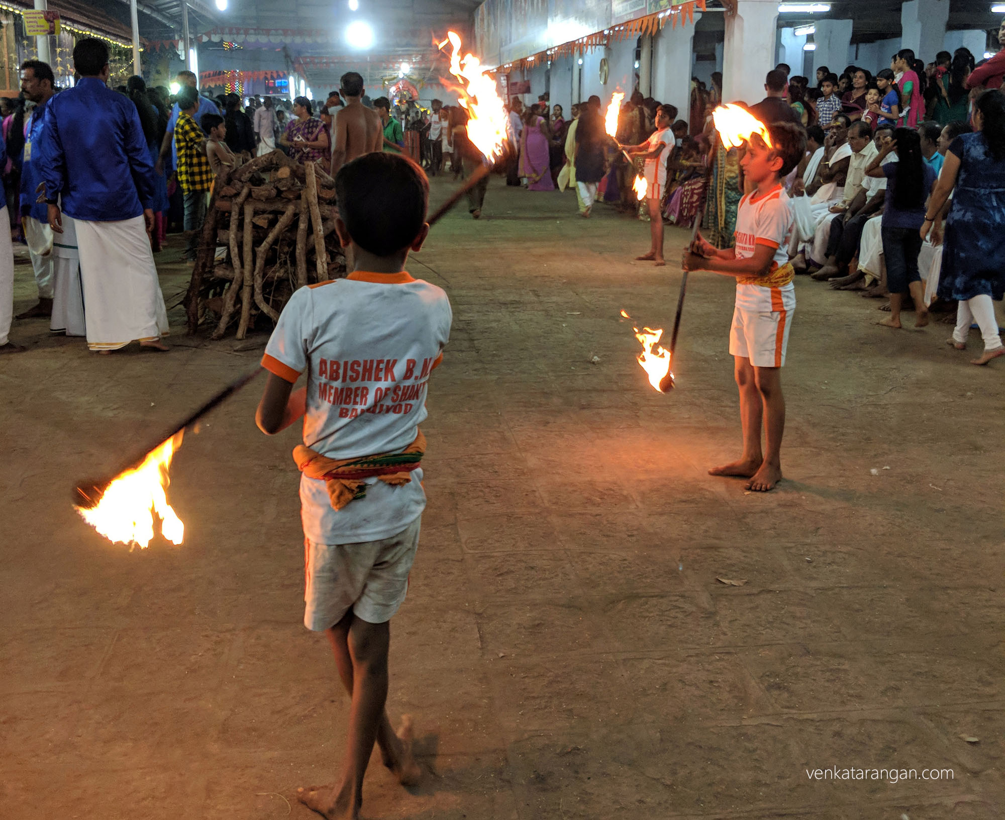 Local school kids showing their traditional self-defence art with lighted sticks