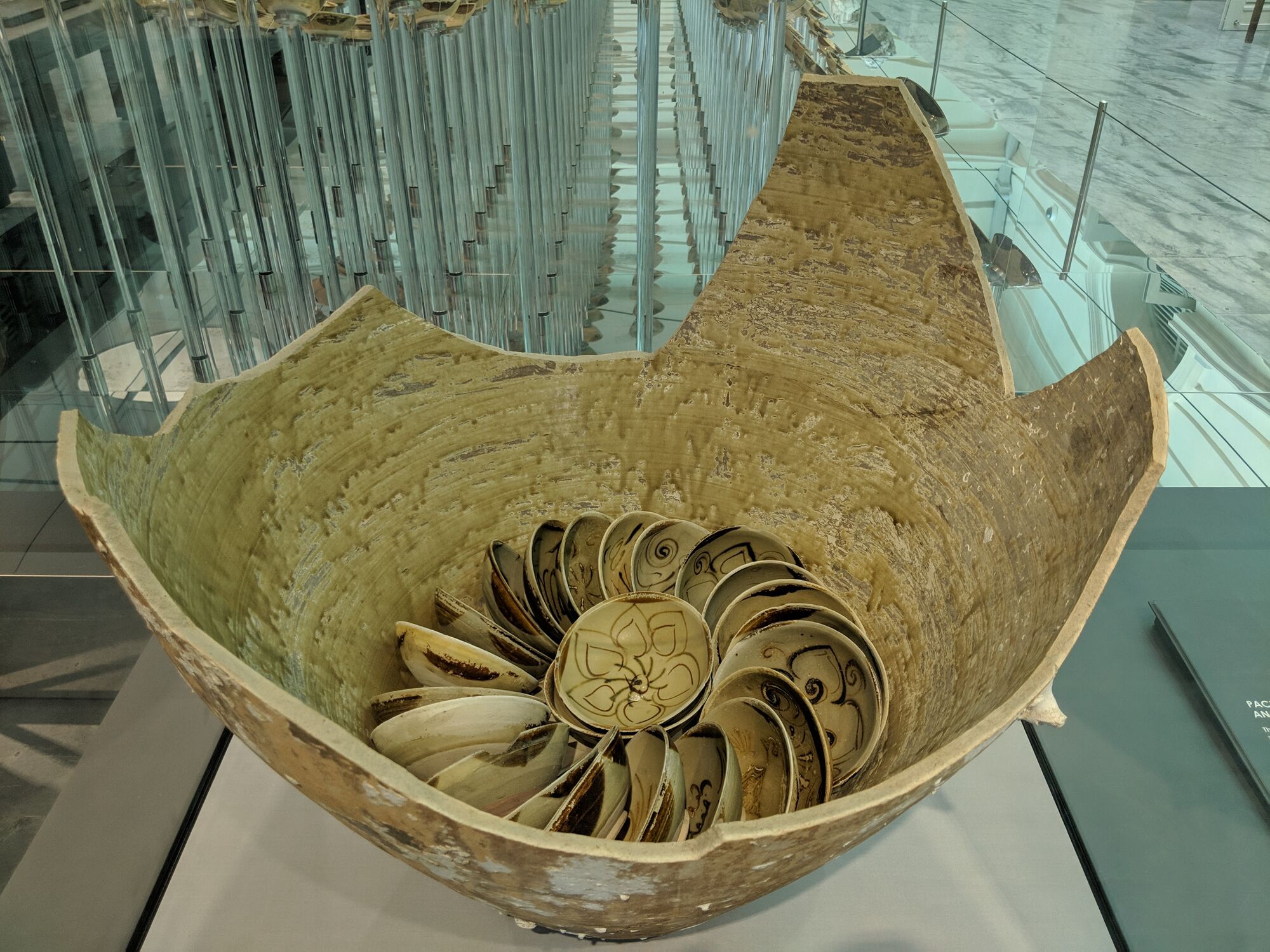 Thousands of ceramic bowls were tightly coiled inside storage jars. About 130 bowls were packed in each jar, cushioned by straw.