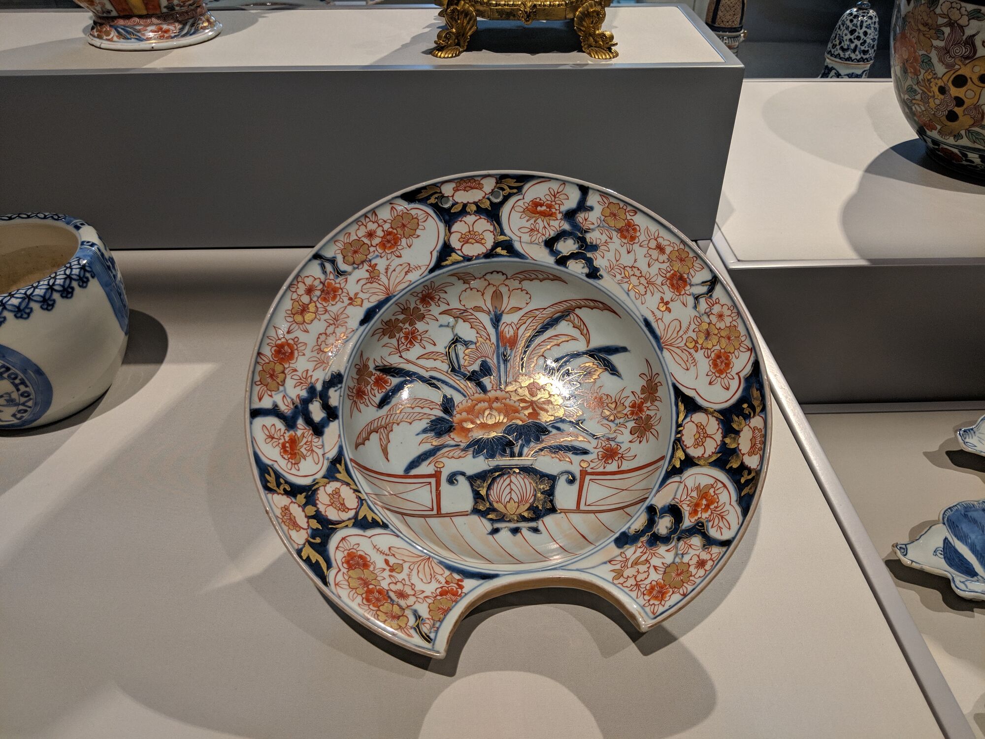 Shaving Basin, Japan, Arita Kilns, early 1700s, Porcelain. Fits under the catch water and lather when shaving. 