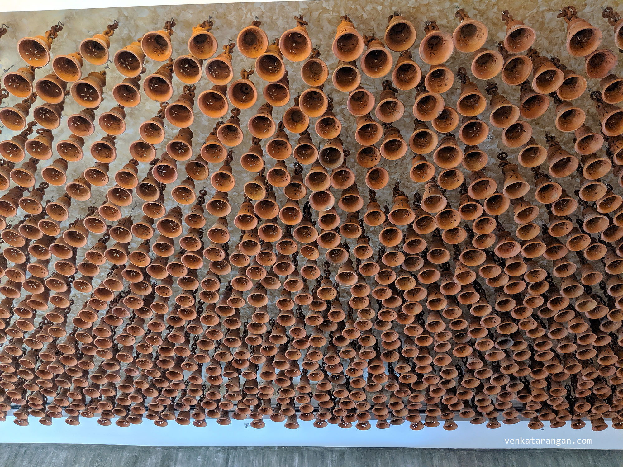 1001 Terracotta bells that have been handcrafted by local potters are hang from the main foyer