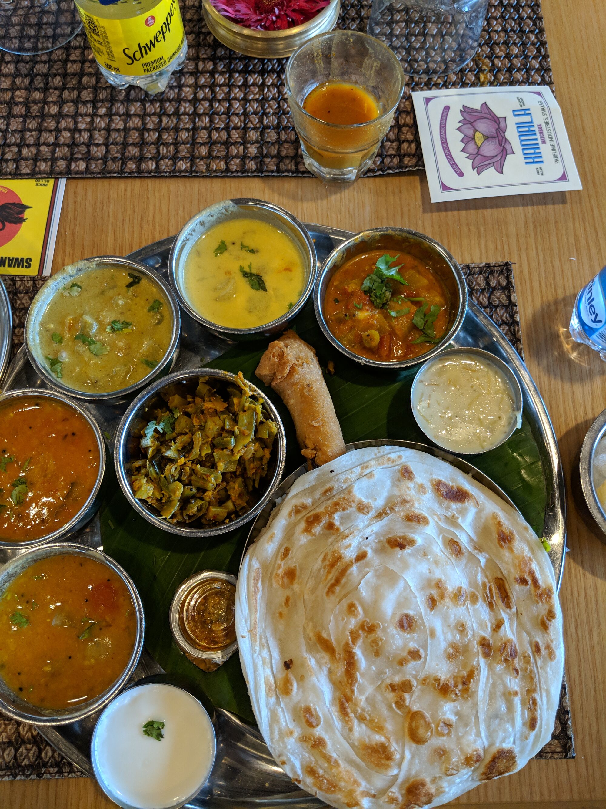 South India Thali - Parota, Kurma, More Kuzhambu, Sambar, Poriyal, Spring Roll, Rasam, Curd & more.