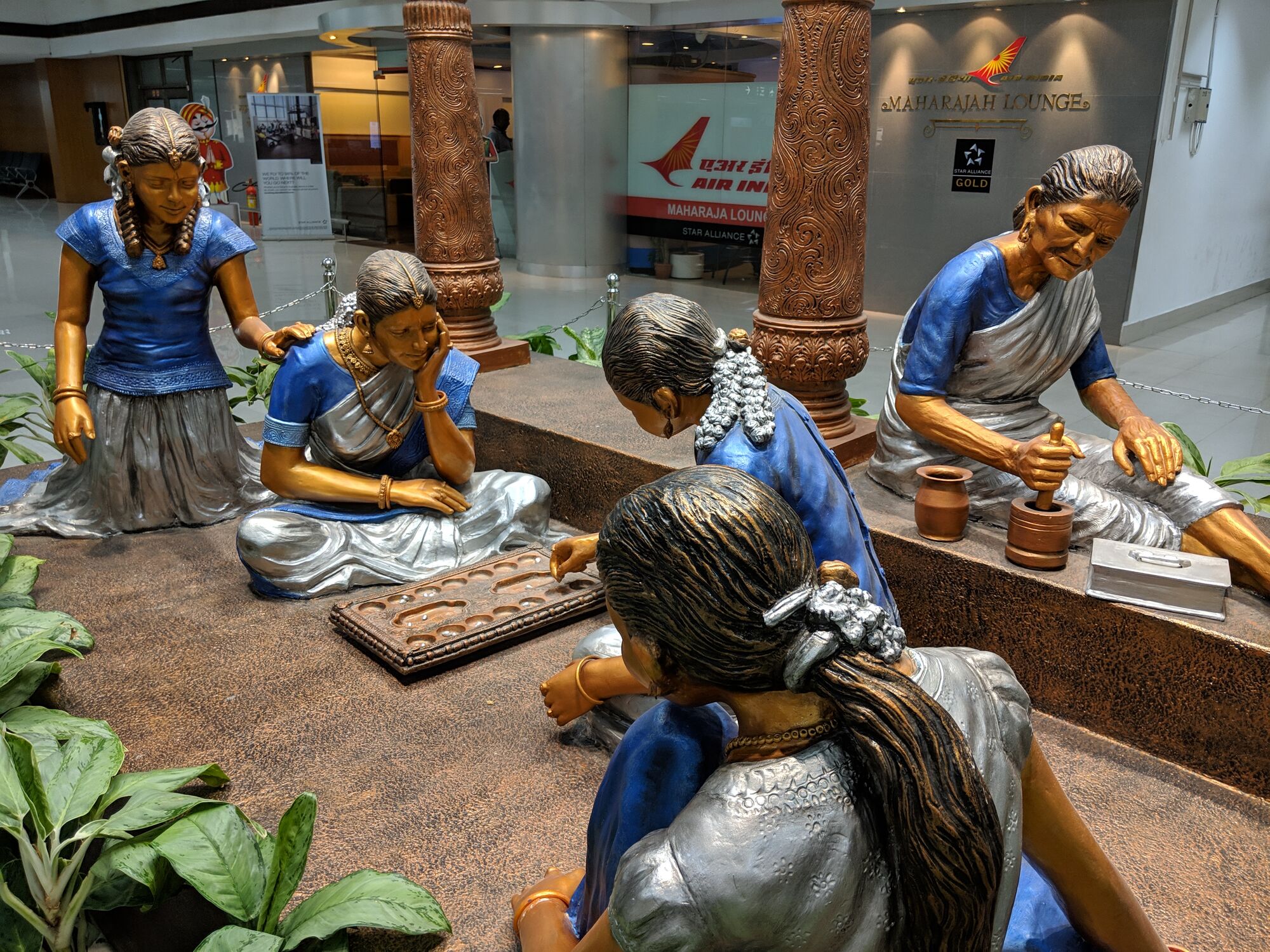 Girls with their grandma playing Pallanghuzi (பல்லாங்குழி)