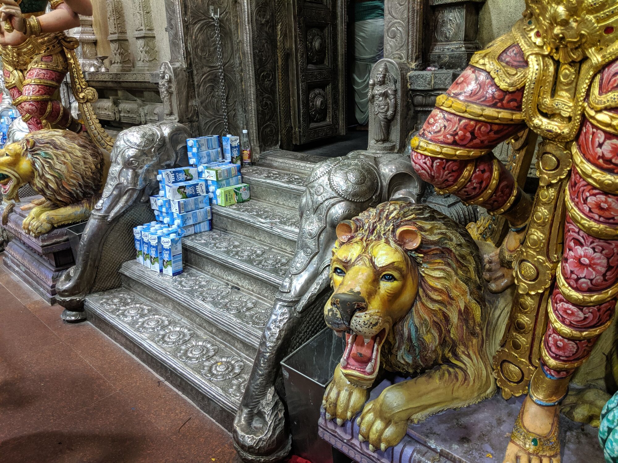 சுவாமி அபிஷேகத்திற்கான பால் பாக்கெட்டுகள். Milk packets lined up for being offered to the Gods