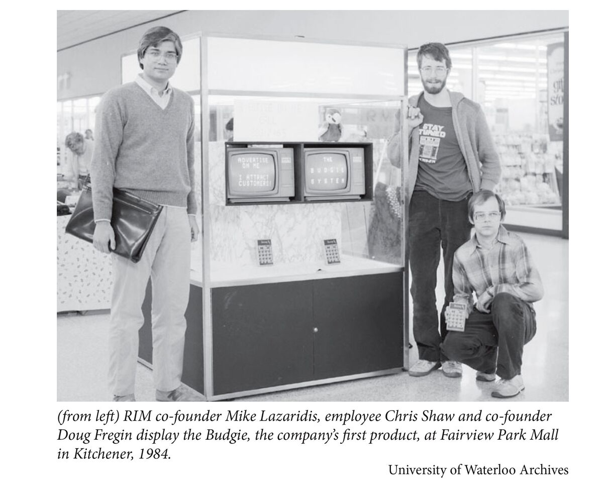 RIM co-founder Mike Lazaridis, employee Chris Shaw and co-founder Doug Fregin display the Budgie, the company’s first product, at Fairview Park Mall in Kitchener, 1984.