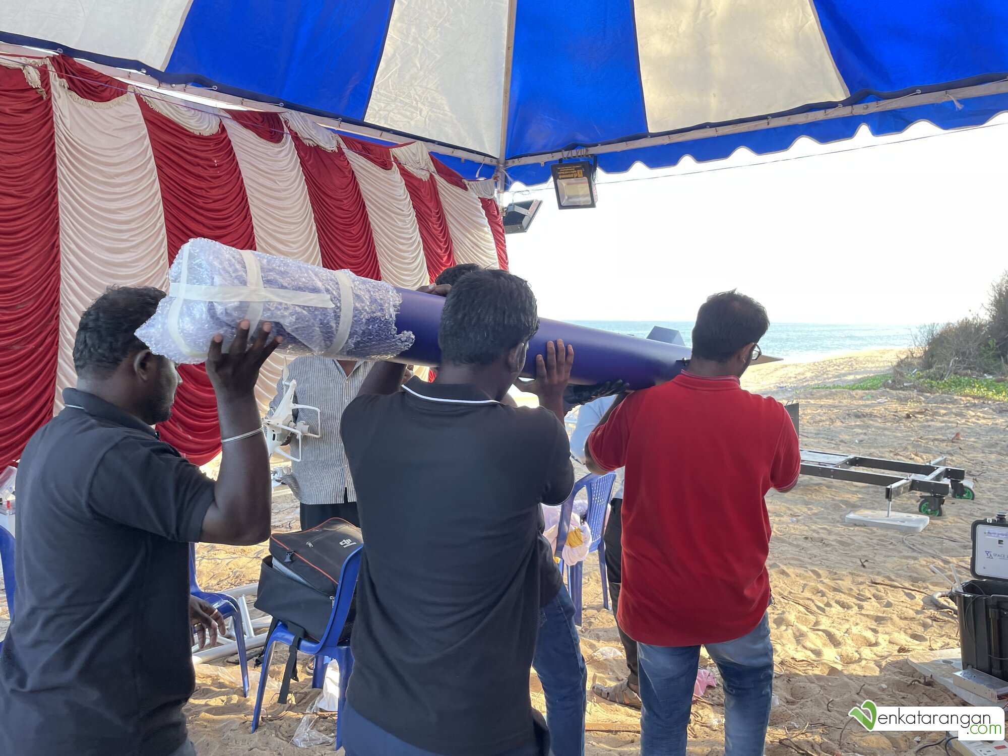The hybrid rocket being carried to the mobile launchpad
