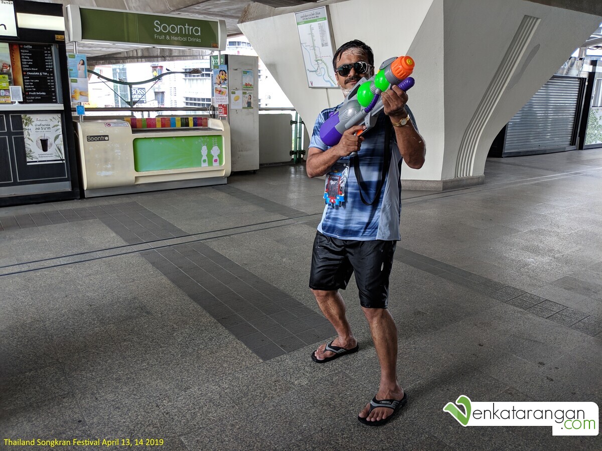 With a water cannon during Songkran