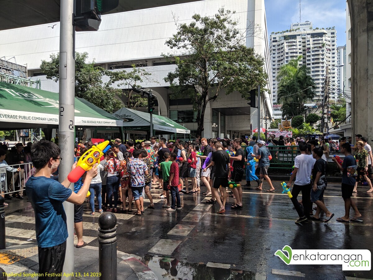 Crowds cheering and playing Songkran in the streets of Bangkok