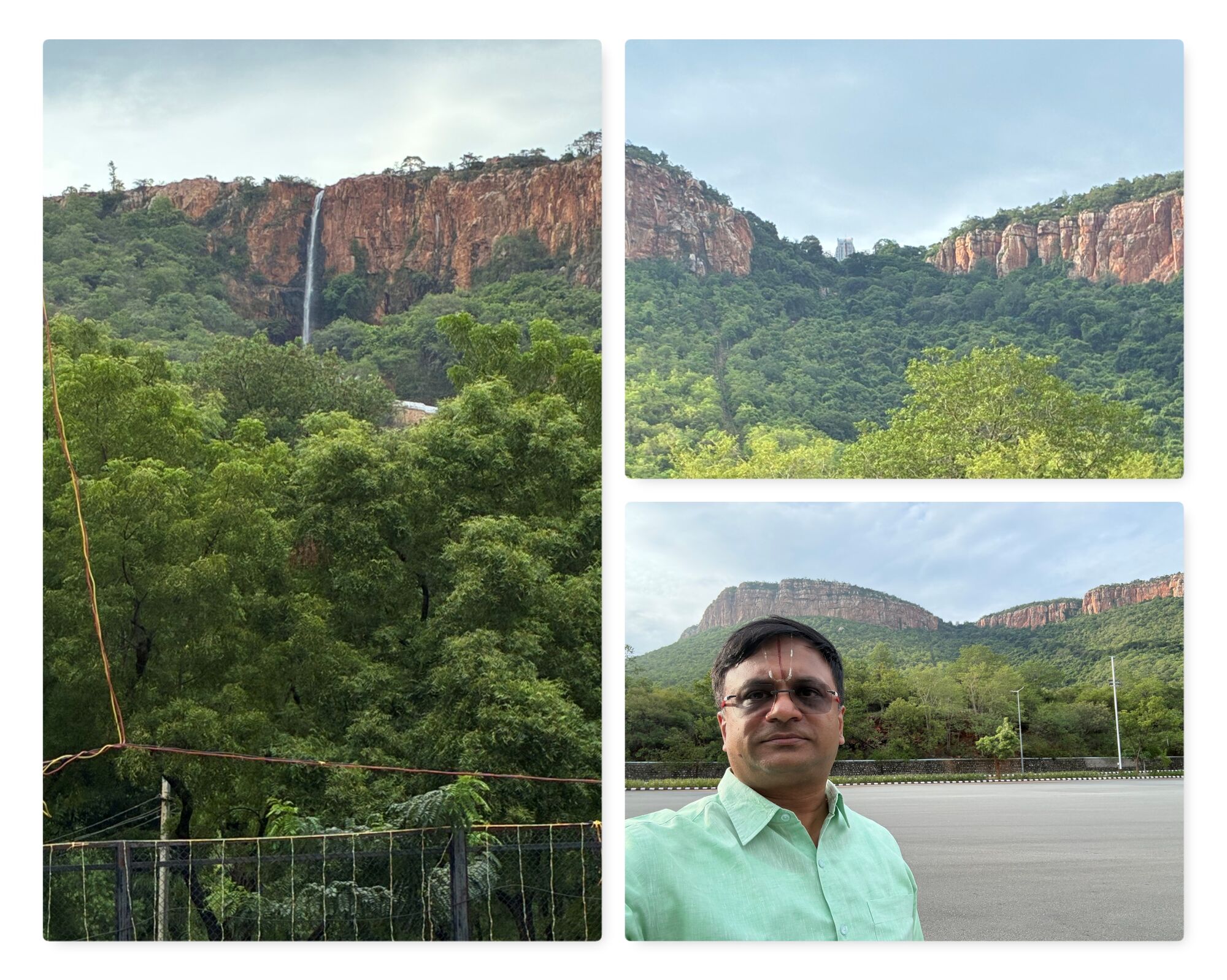 A monsoon waterfall streaks down the red rock face of the Tirumala hills, with the temple just visible through a gap between the peaks.